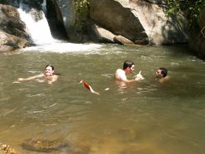 Swimming at waterfall in