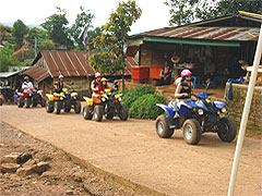 Atv tour - through a hilltribe village, Chiang Mai, Thailand 