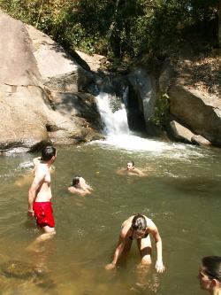 Swimming at secluded waterfall in